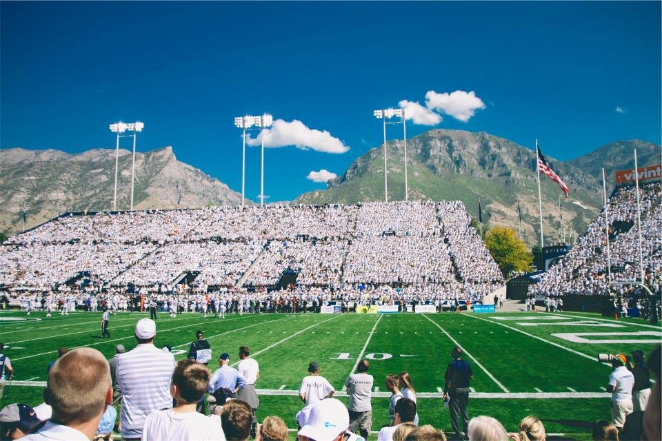 Football on a grass field ready for kickoff