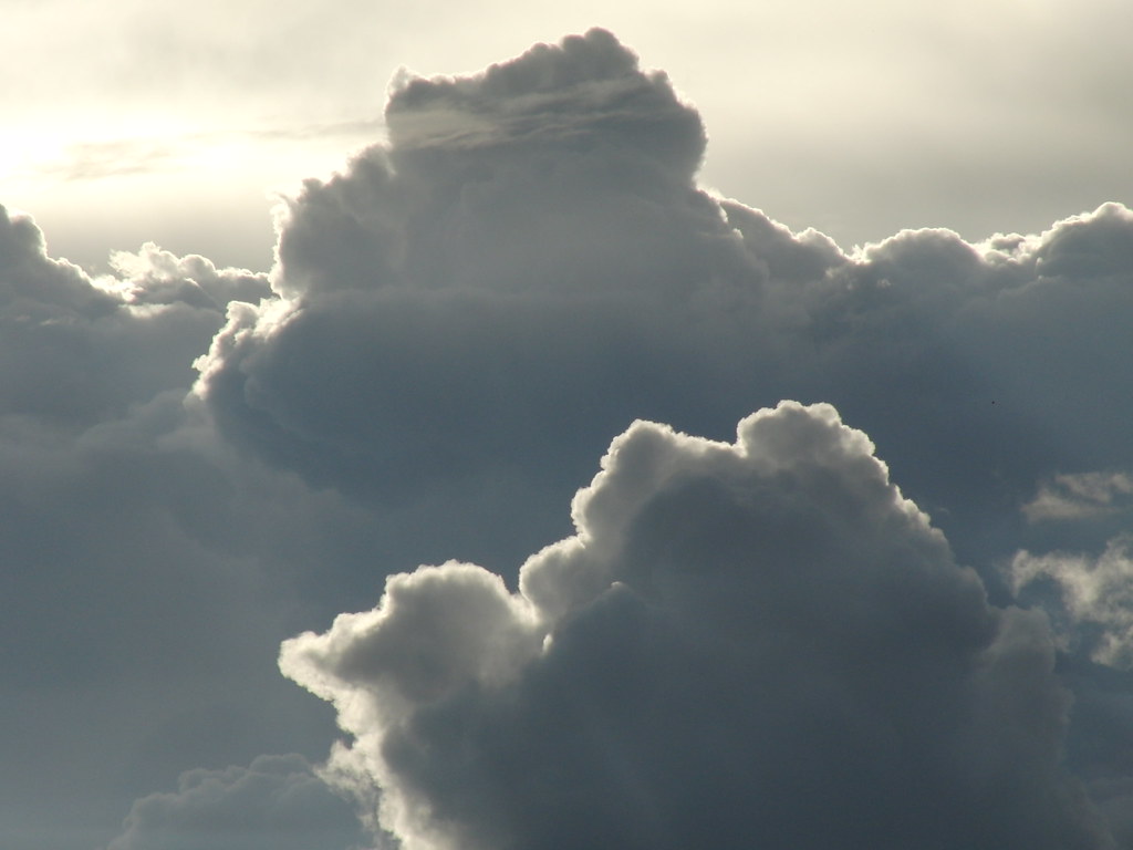 Puffy clouds in a blue sky