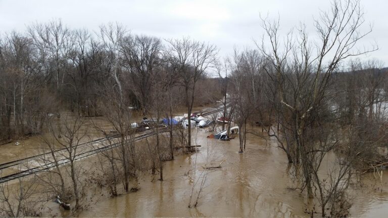 Flash Flood Sends Mud Past Golf Course, Swamps Homes